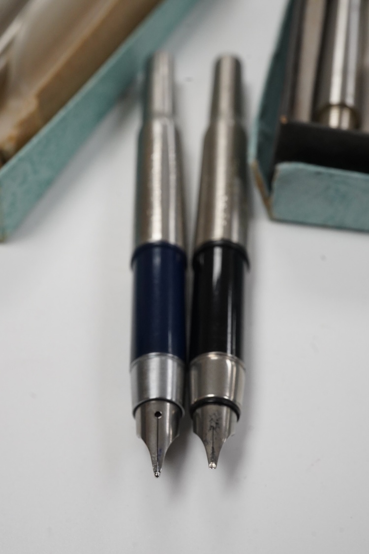 A quantity of Parker 25 fountain pens and ballpen spares including rare orange parts